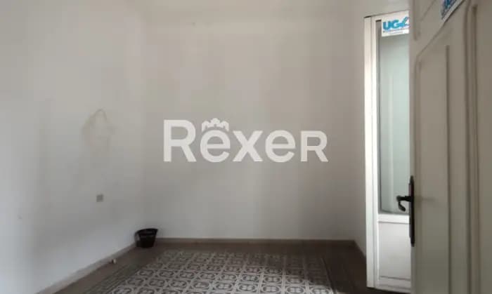 Rexer-Sulmona-Appartamento-con-due-camere-da-letto-camino-balcone-cantina-CameraDaLetto
