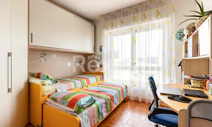 Rexer-Oristano-Affascinante-appartamento-al-sesto-piano-comfort-e-vista-panoramica-CAMERA-DA-LETTO