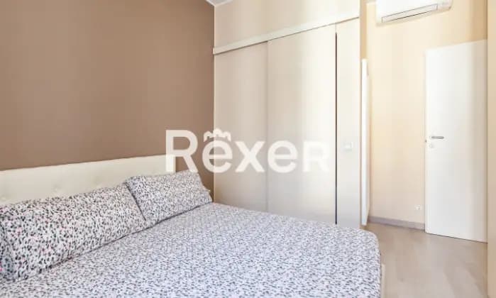 Rexer-Milano-Appartamento-ristrutturato-stabile-depoca-CameraDaLetto