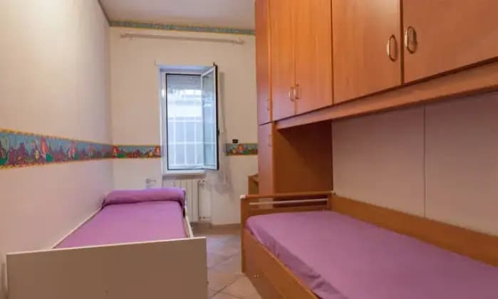 Rexer-Fiumicino-Appartament-Passoscuro-Bambin-Ges-CAMERA-DA-LETTO